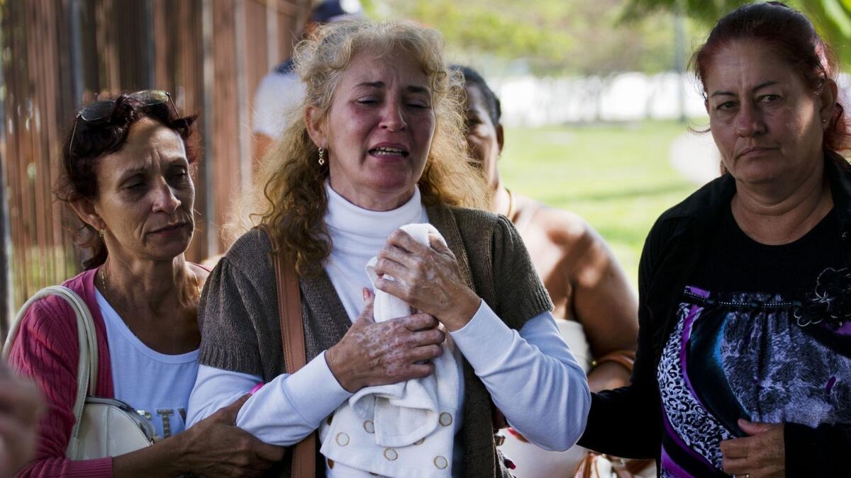 Grieving relatives of passengers who died in Cuba's worst aviation disaster leave a morgue in Havana on Saturday.
