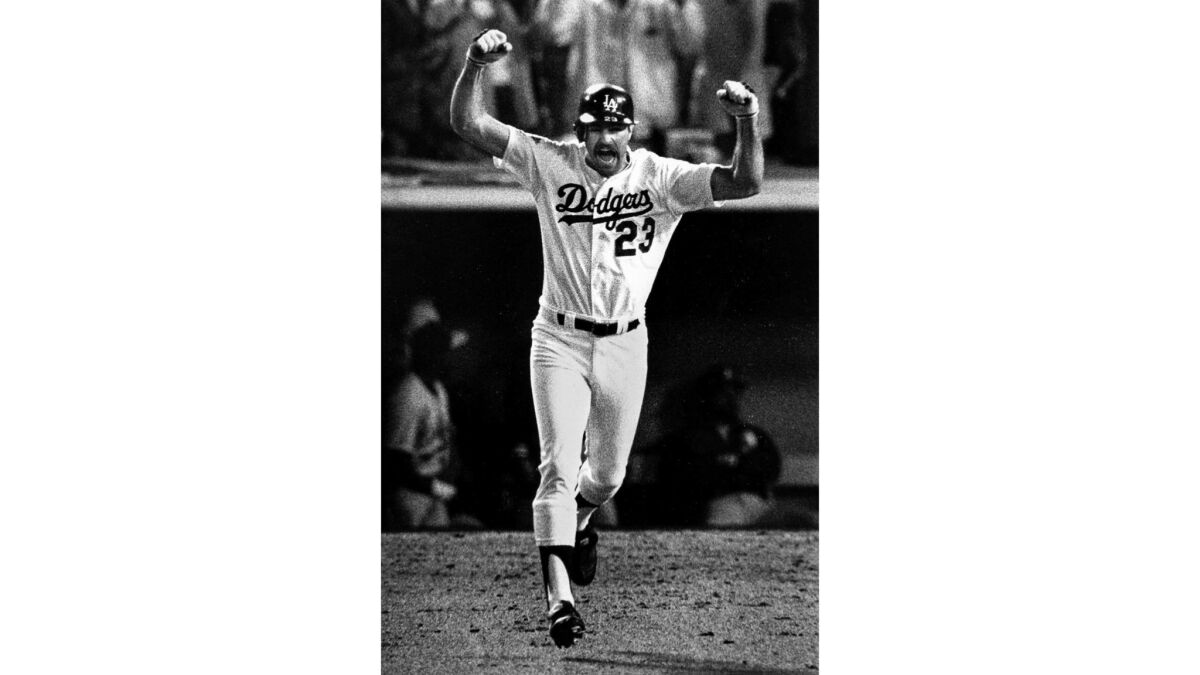 Oct. 15, 1988: Kirk Gibson raises his arms in celebration after hitting a game-winning two-run homer.