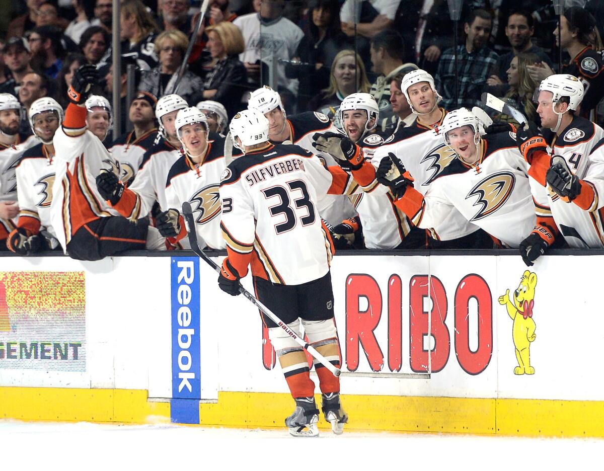 Ducks right wing Jakob Silfverberg celebrates with his teammates after his overtime shootout goal against the Kings Saturday night.