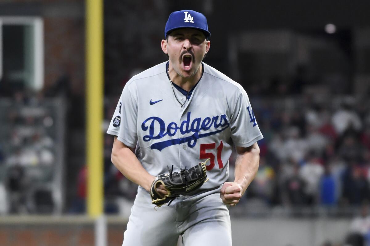 Atlanta, GA - October 17: Los Angeles Dodgers relief pitcher Alex Vesia reacts after retiring the side during the fifth.