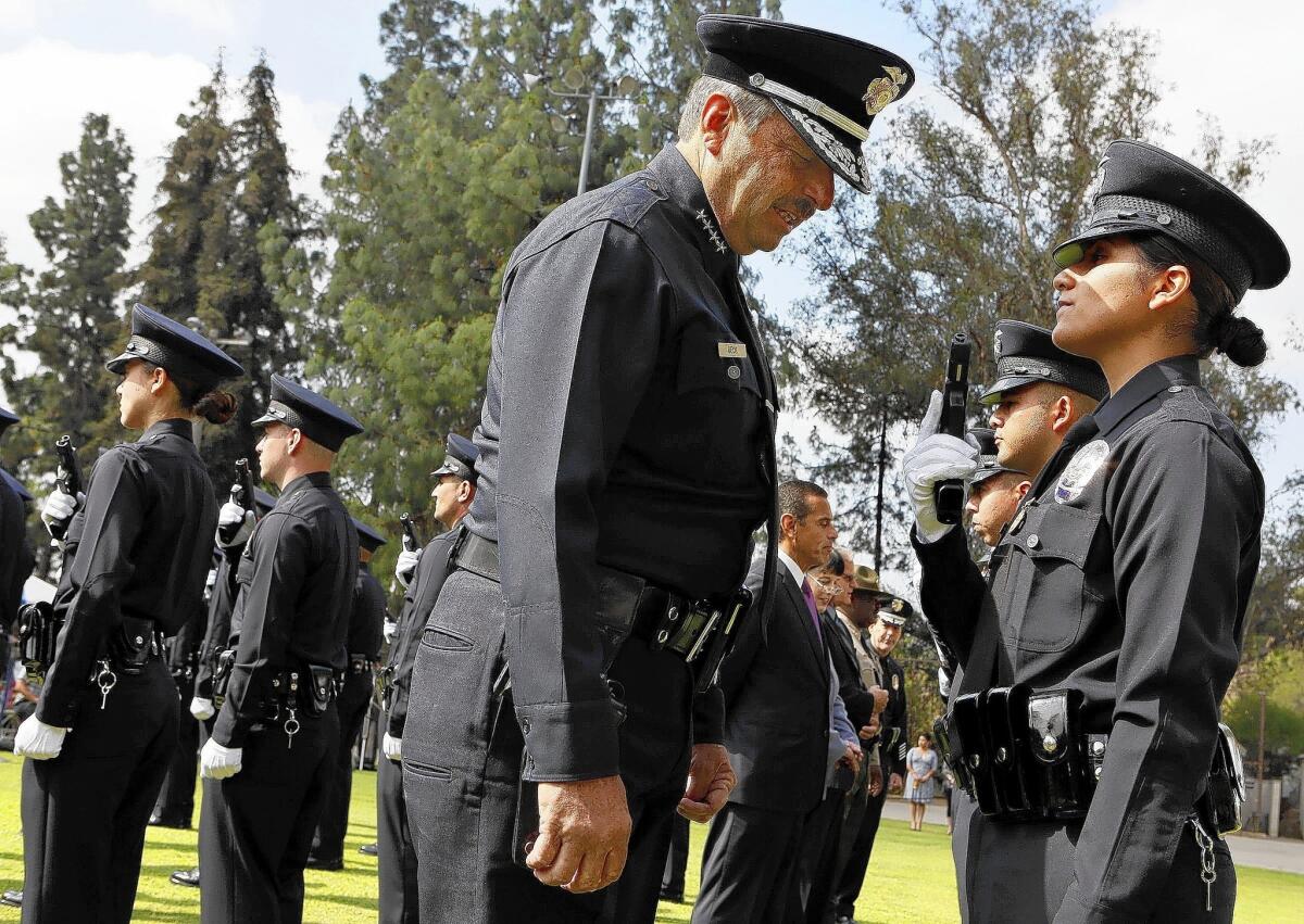 LAPD Chief Charlie Beck inspects the graduating class of recruits during a ceremony in 2012.