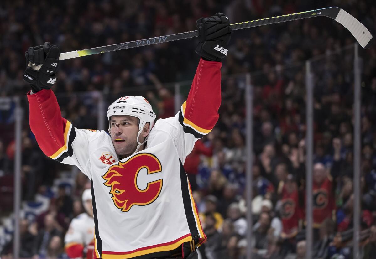 Calgary Flames' Sean Monahan, left, celebrates his goal against