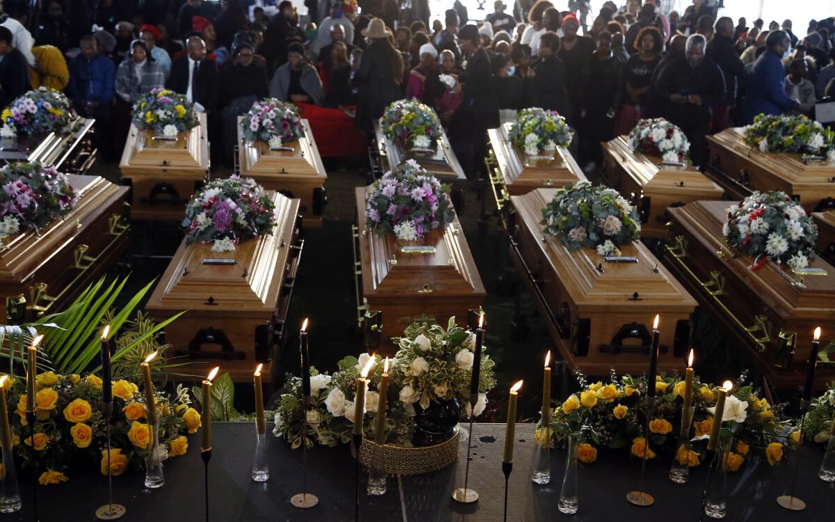 Coffins of 21 teenagers who died in a mysterious tragedy.