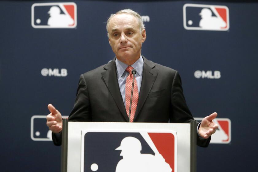 FILE - In this Nov. 21, 2019, file photo, baseball commissioner Rob Manfred speaks to the media.