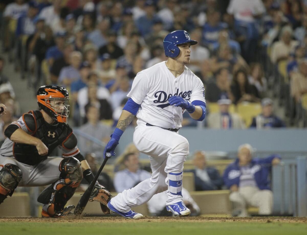 Dodgers catcher Yasmani Grandal watches a fly out against the Giants on Sept. 2.