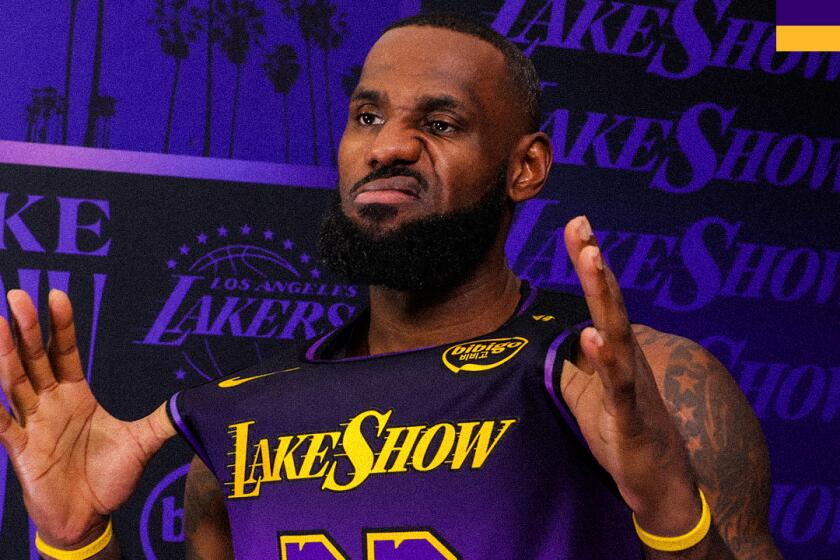 LeBron James makes a funny face as he tries on the Lakers' City Edition uniform for the 2024-2025 season.