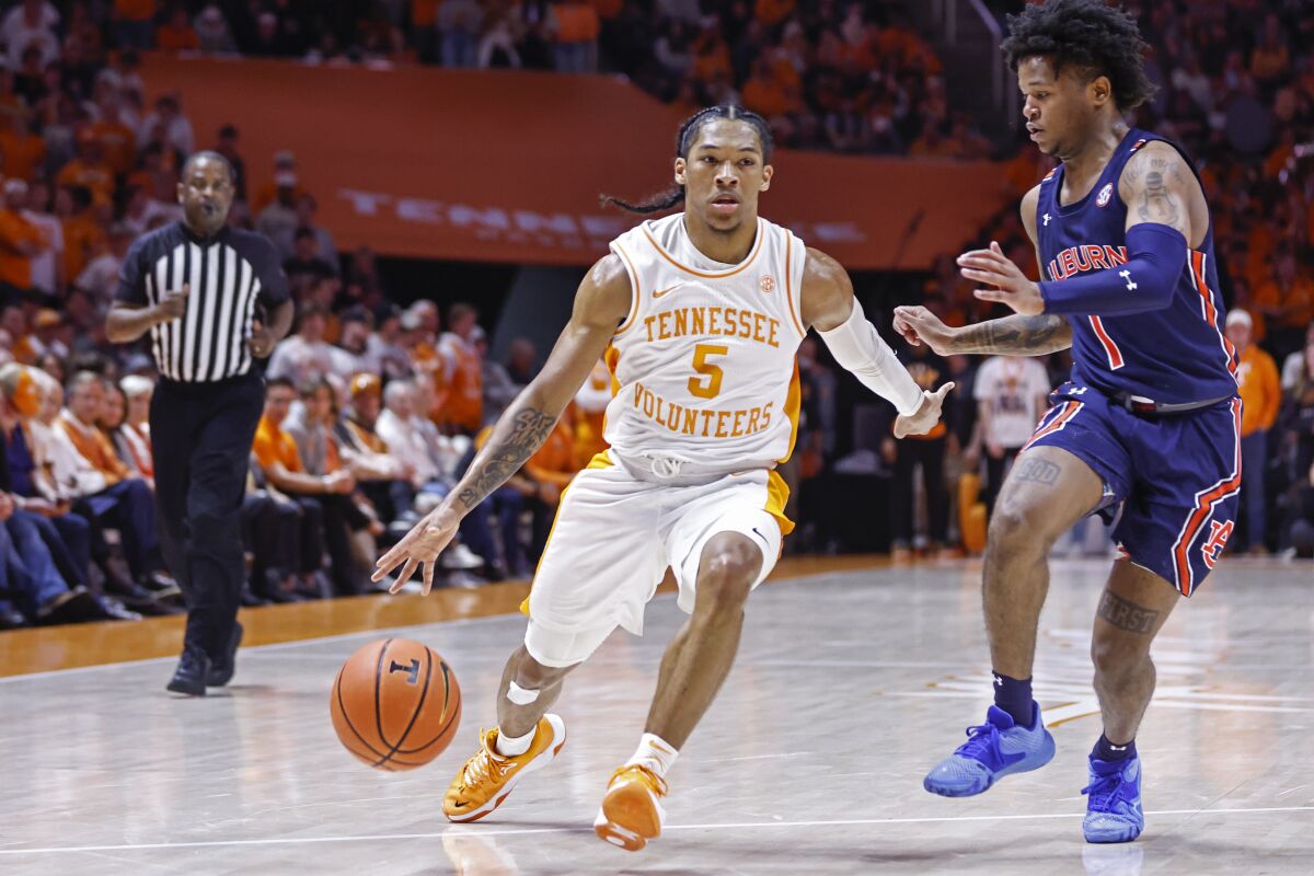Tennessee's Zakai Zeigler drives against Auburn's Wendell Green Jr. on Feb. 26, 2022.