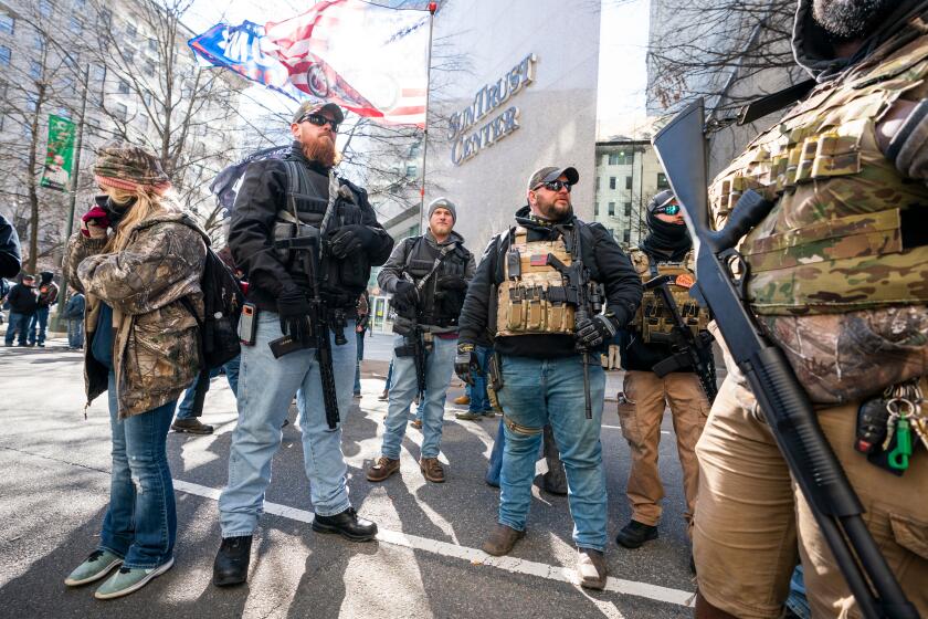 Mandatory Credit: Photo by JIM LO SCALZO/EPA-EFE/REX (10530997cd) Gun-rights supporters gather for a rally outside the Virginia state capitol in Richmond, Virginia, USA, 20 January 2020. Virginia Citizens Defense League organized the rally to lobby against gun measures, introduced by Virginia's Democratic-led assembly, that would require background checks and ban guns in some public parks and buildings. The rally also attracted militia members, white supremacists, and other far-right extremists. Gun rights rally in Richmond, Virginia, USA - 20 Jan 2020 ** Usable by LA, CT and MoD ONLY **