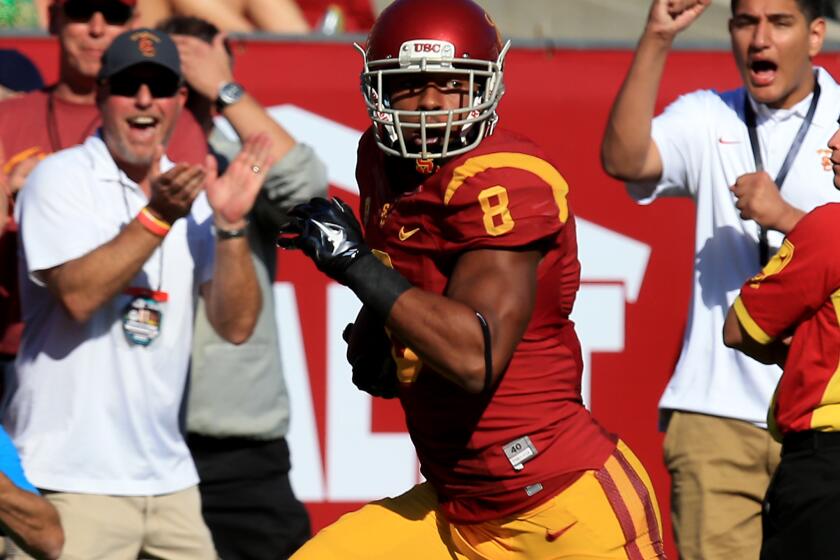USC wide receiver George Farmer breaks away for one of his two touchdowns against Notre Dame back in November.