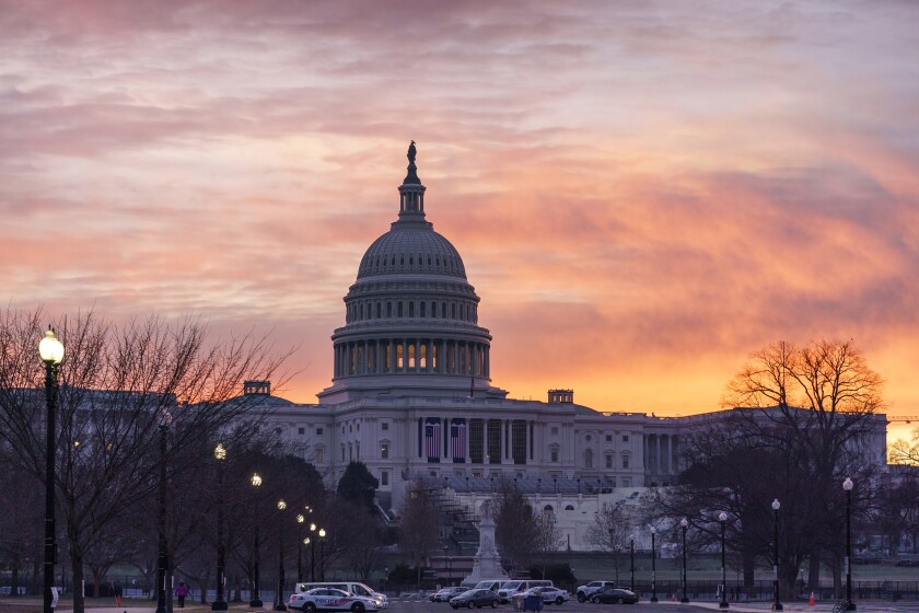 Dawn breaks at the Capitol in Washington, Monday, Jan. 11, 2021.  