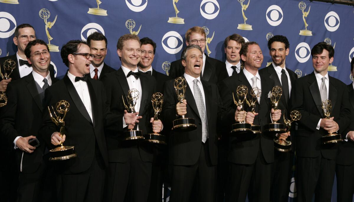 Jon Stewart and writing staff of "The Daily Show With Jon Stewart" pose with their Emmys.