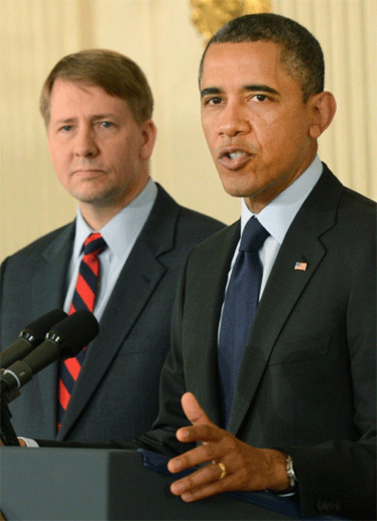 President Obama introduces Richard Cordray, left, as his re-nominee to stay as the Director of the United States Consumer Financial Protection Bureau.