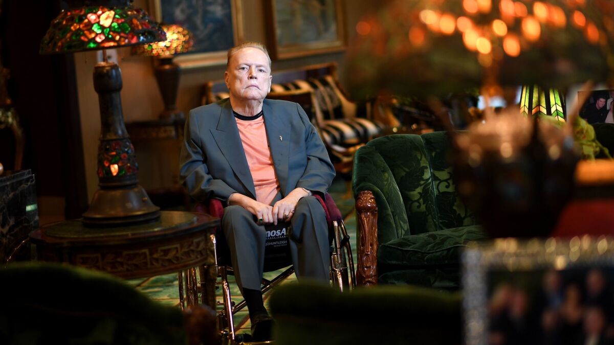 Larry Flynt sits in a wheelchair