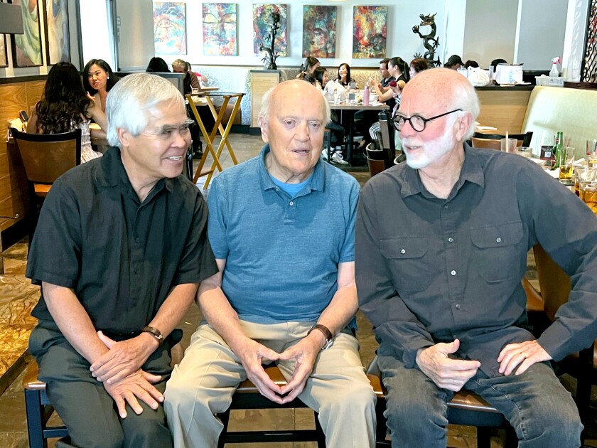 Pulitzer Award winners Nick Ut, left, Peter Arnett, center, and David Hume Kennerly