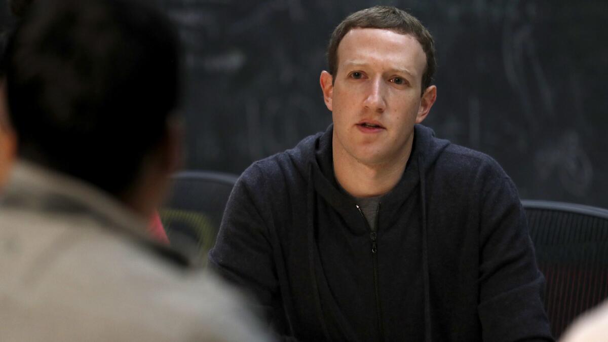 Facebook Chief Executive Mark Zuckerberg, shown in a 2017 meeting with entrepreneurs in St. Louis, has not commented on the controversy surrounding Cambridge Analytica's alleged misuse of Facebook user data.
