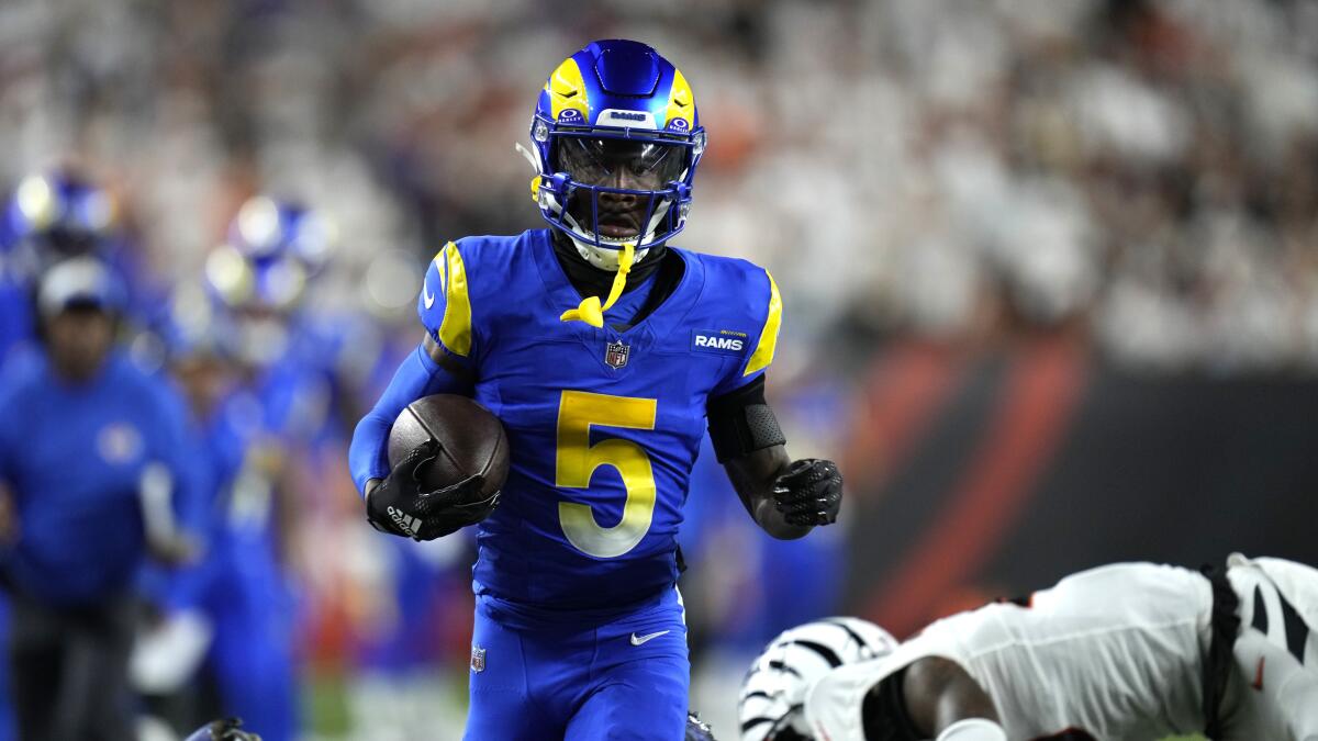 Rams wide receiver Tutu Atwell runs with the ball during the first quarter.