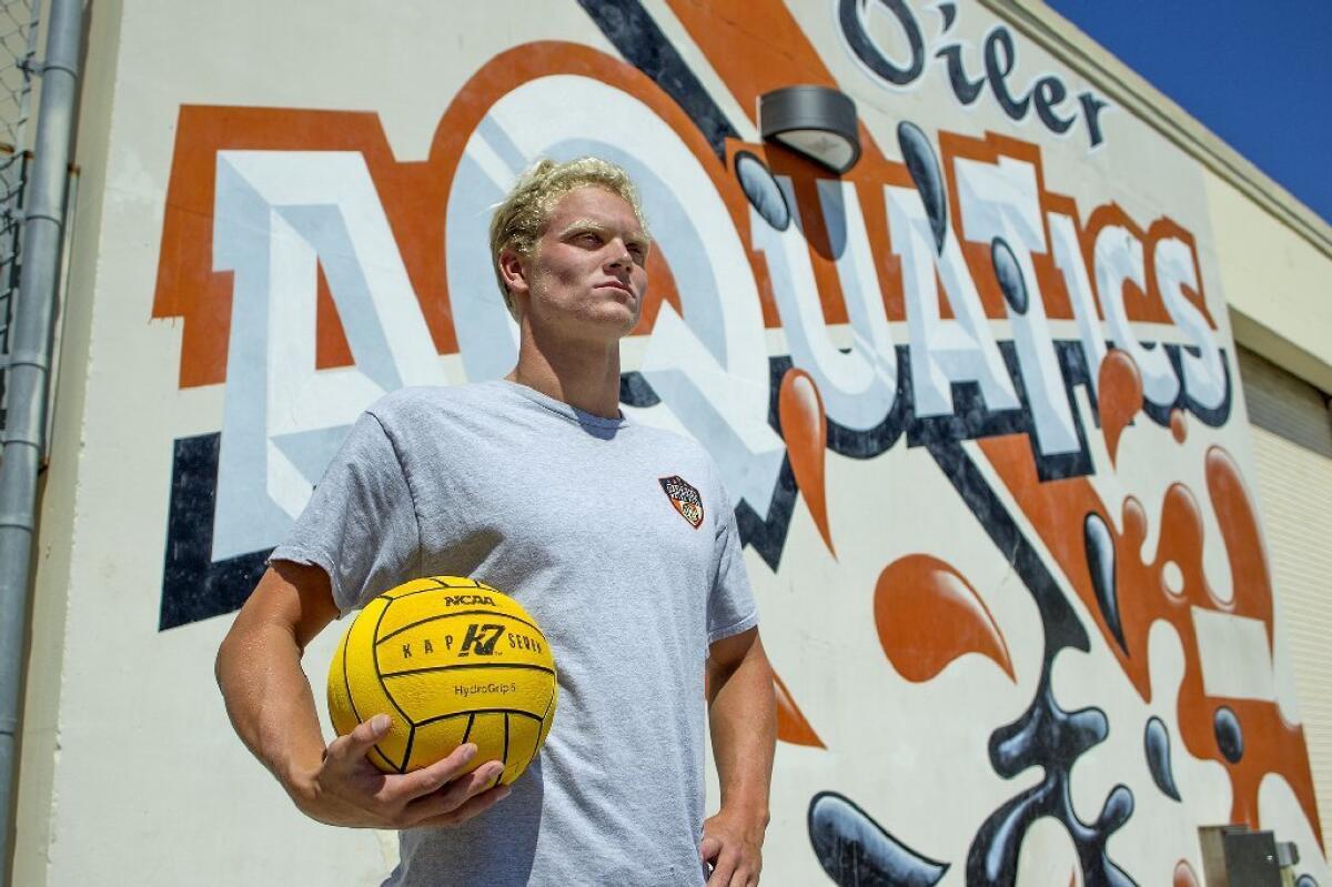 Huntington Beach High’s Ethan Wojciechowski, a senior team captain, helped the Oilers beat Corona del Mar in a match on Saturday.