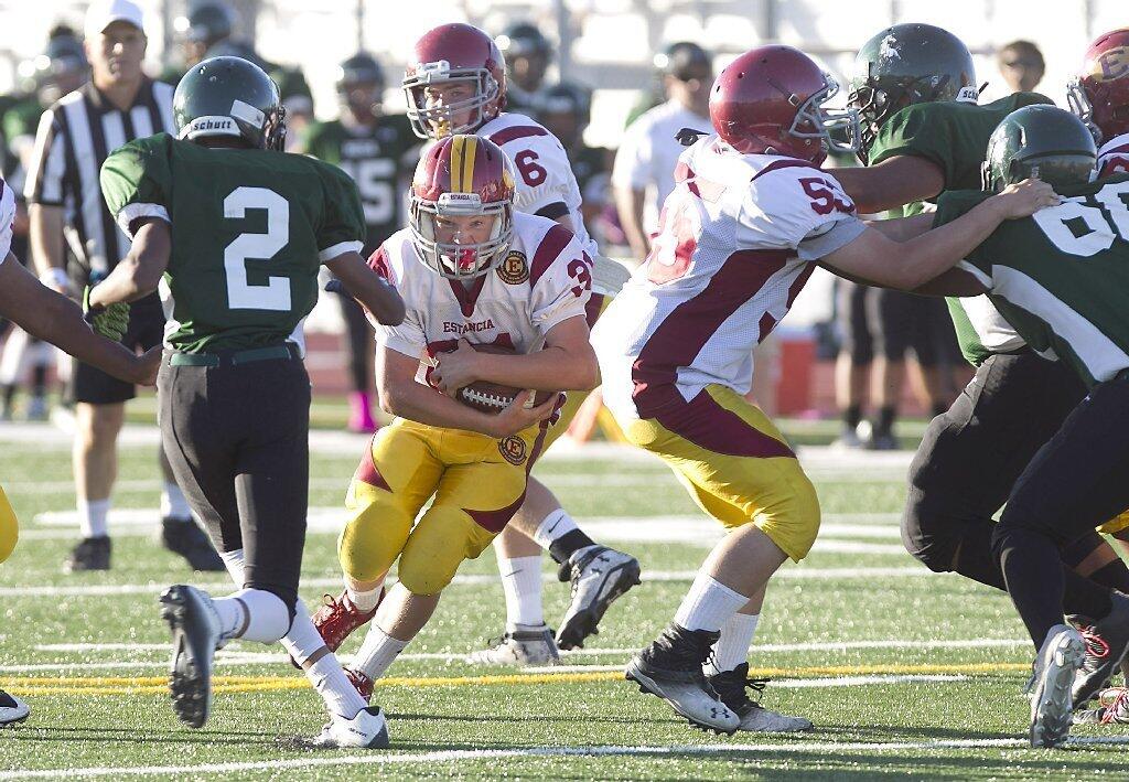 Estancia High's Nathan Pacheco runs toward the end zone against Costa Mesa during the frosh-soph Battle for the Bell.