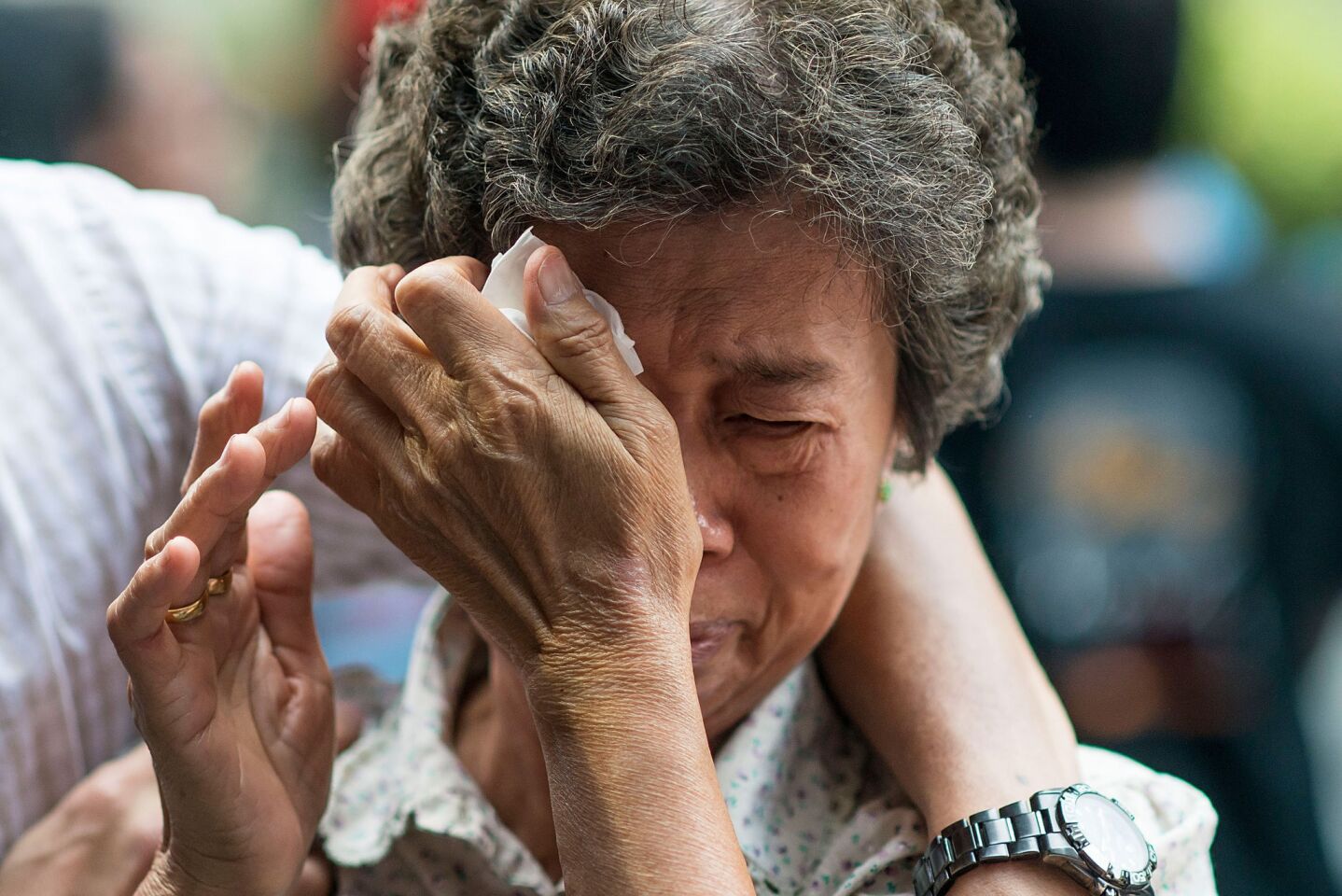 The mother of a Flight MH370 passenger reacts at a memorial service in Kuala Lumpur, Malaysia.
