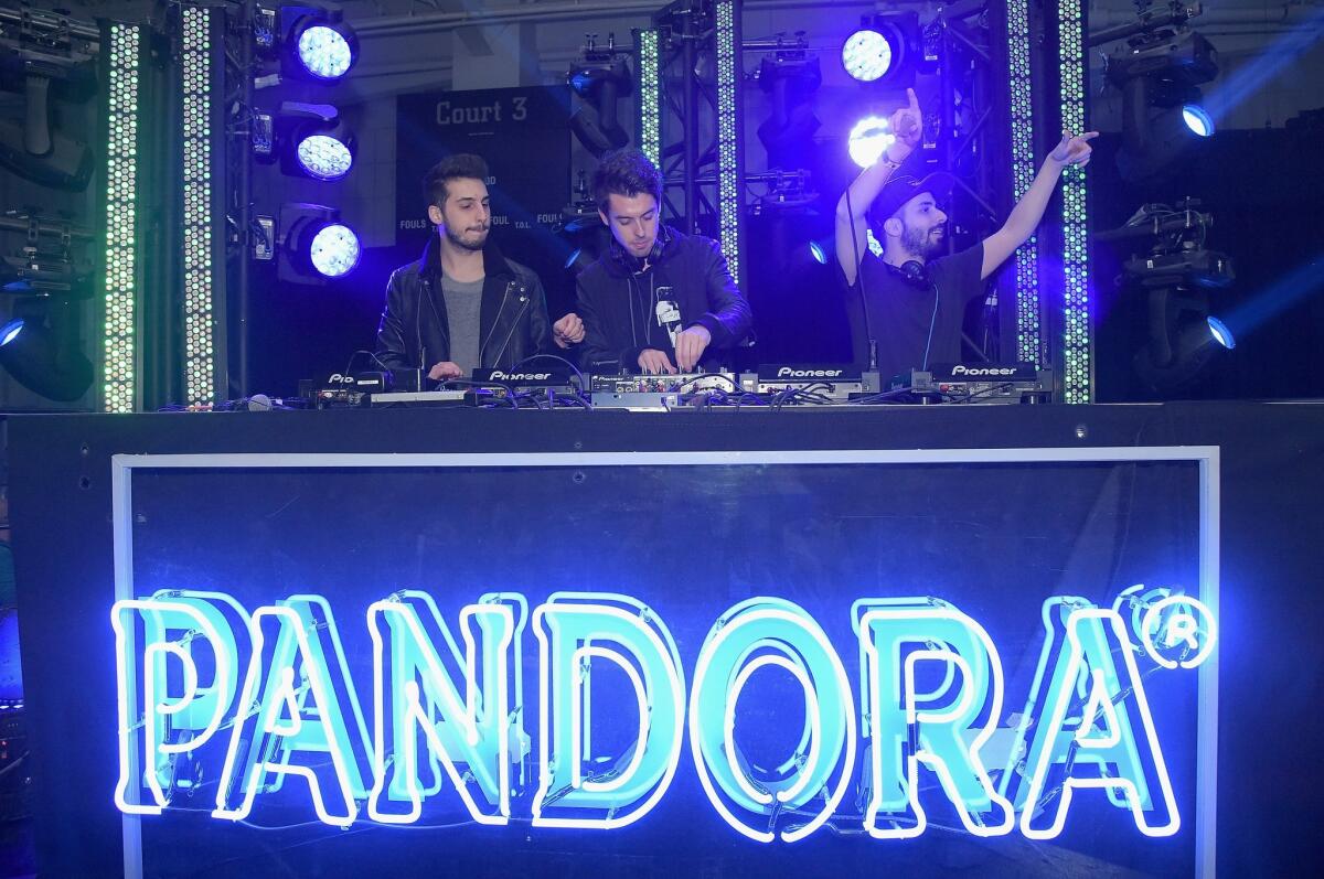 Jean Paul Makhlouf, Samuel Frisch, and Alex Makhlouf perform onstage at the Pandora Holiday at Pier 36 in New York.