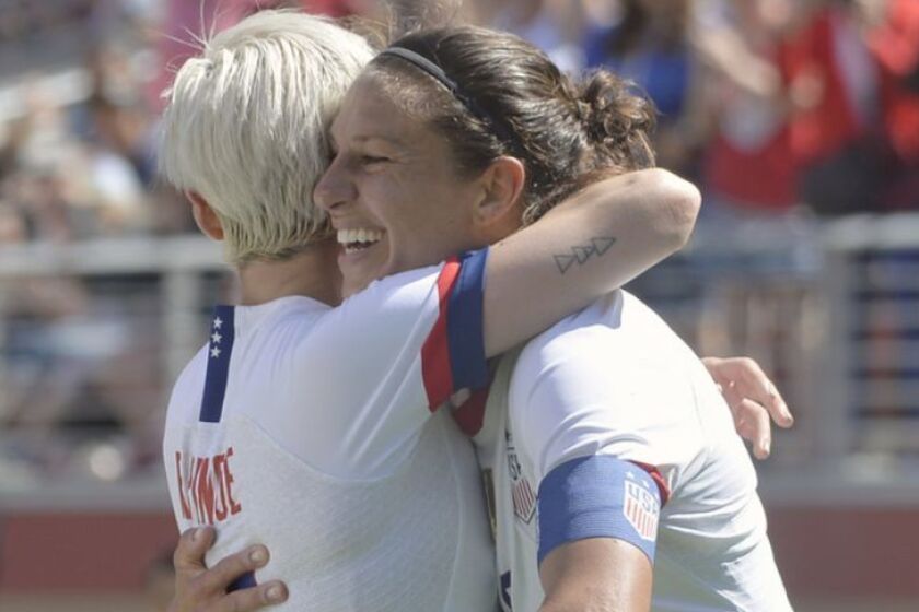 Carli Lloyd (10) gets a hug from forward Megan Rapinoe (15) after scoring a goal for the U.S.