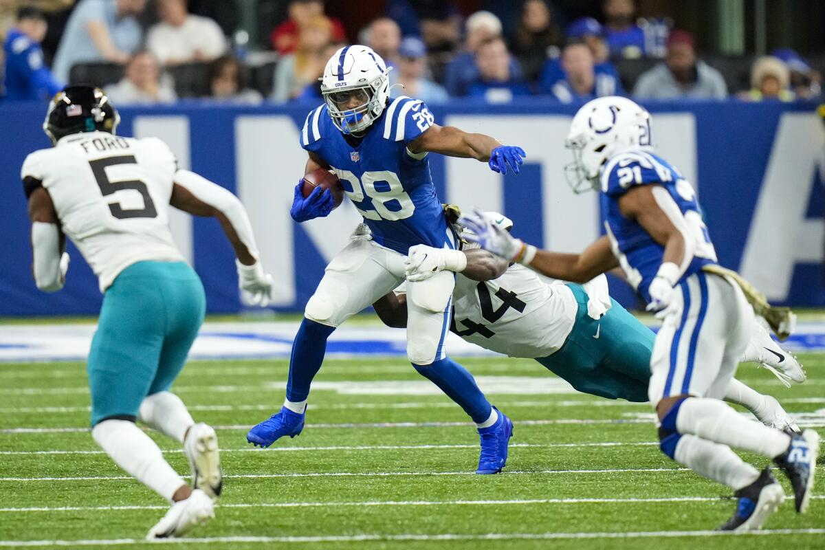 Indianapolis Colts running back Jonathan Taylor carries the ball against the Jacksonville Jaguars.
