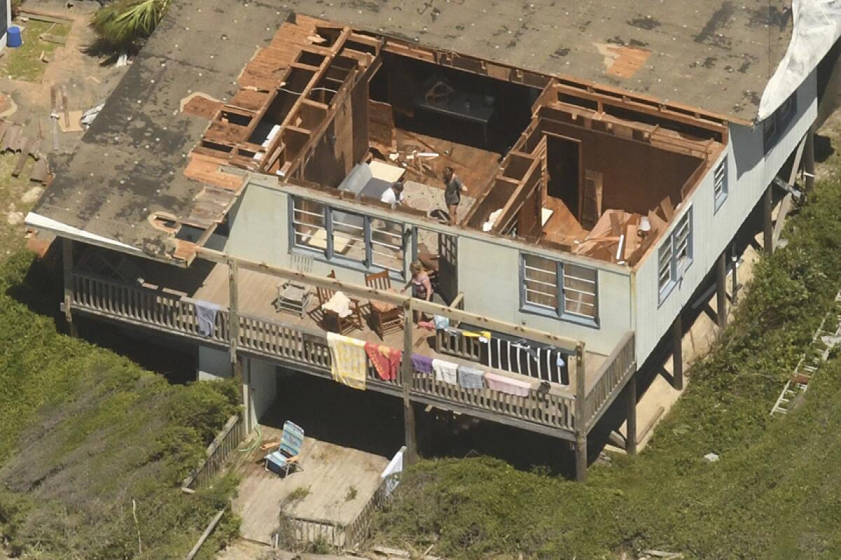 A home in Oak Island, N.C., on Tuesday after Isaias passed through.