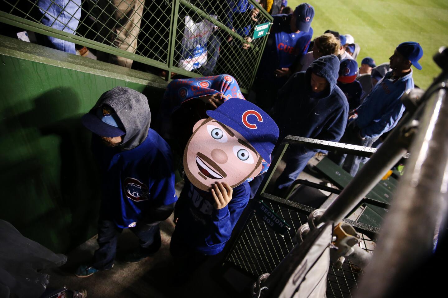 Cubs fans file out of Wrigley Field after losing Game 3.