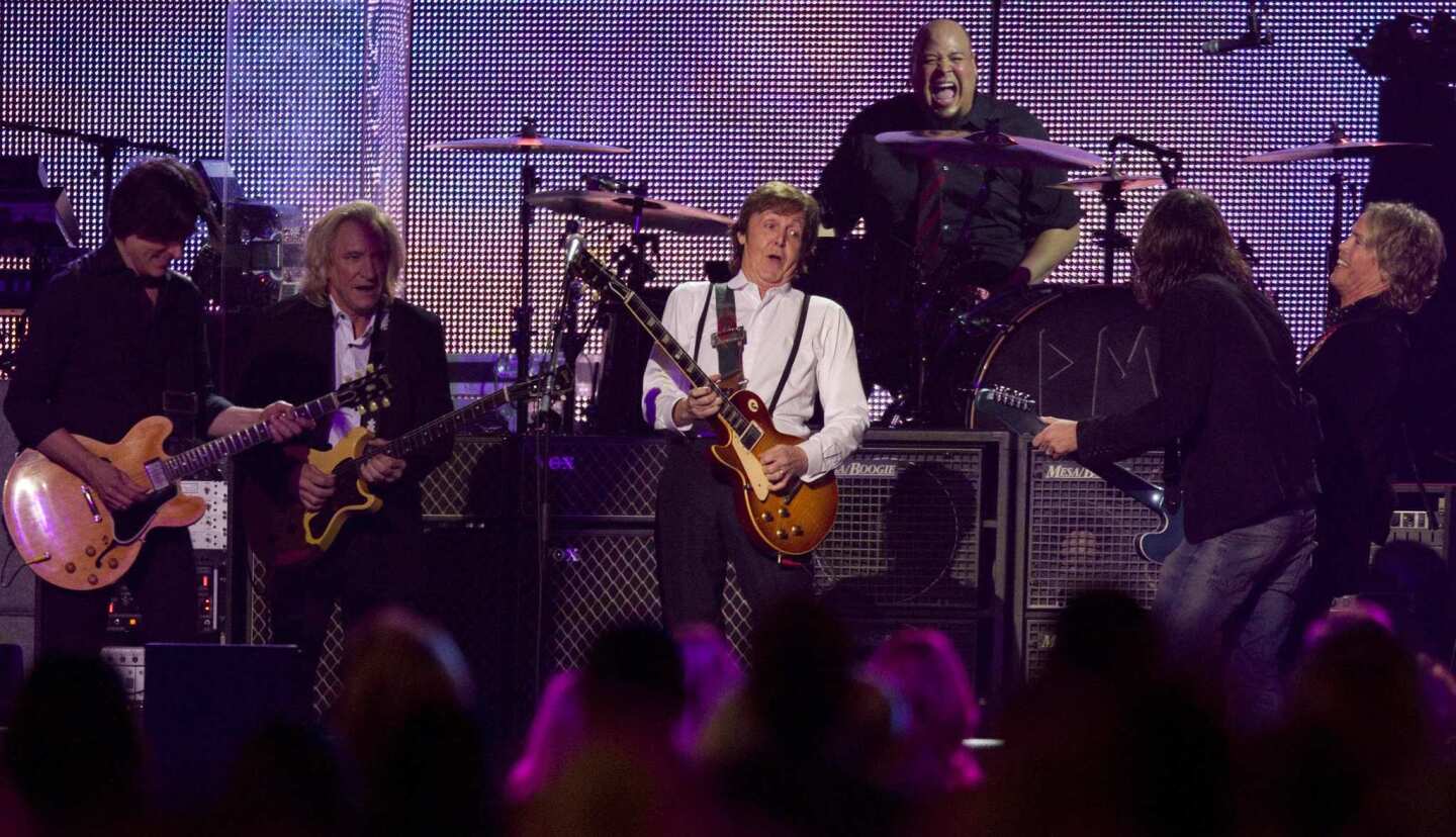 Paul McCartney jams with friends.