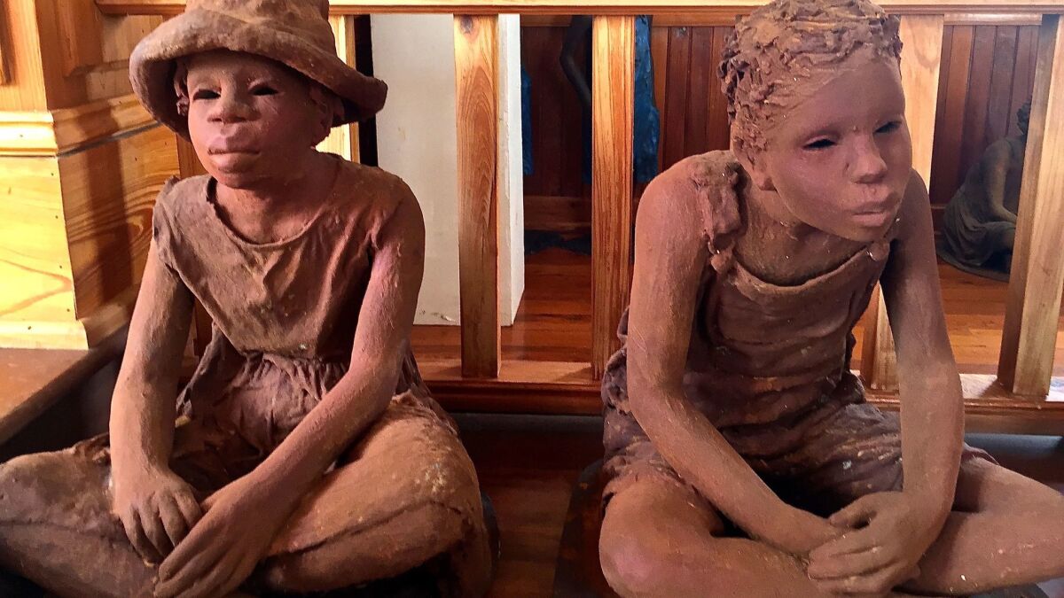 Sculptures of slave children were commissioned for the museum at the Whitney Plantation in Wallace, La.