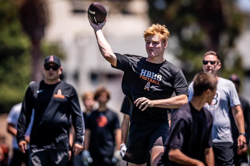 Huntington Beach's Brady Edmunds releases a throw on Saturday in the Surf City Passing and Linemen Tournament.