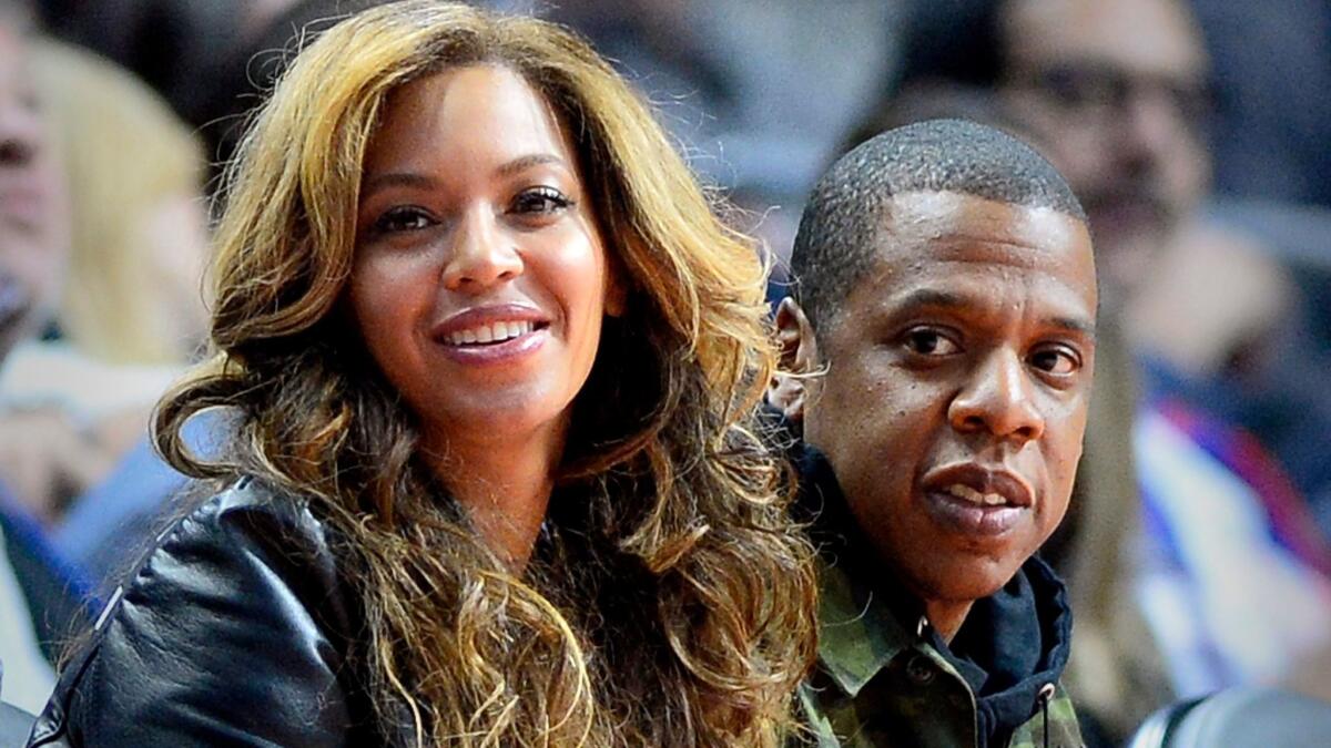Beyonce and Jay-Z courtside at L.A.'s Staples Center as they watch the Brooklyn Nets play the Los Angeles Clippers in 2015.
