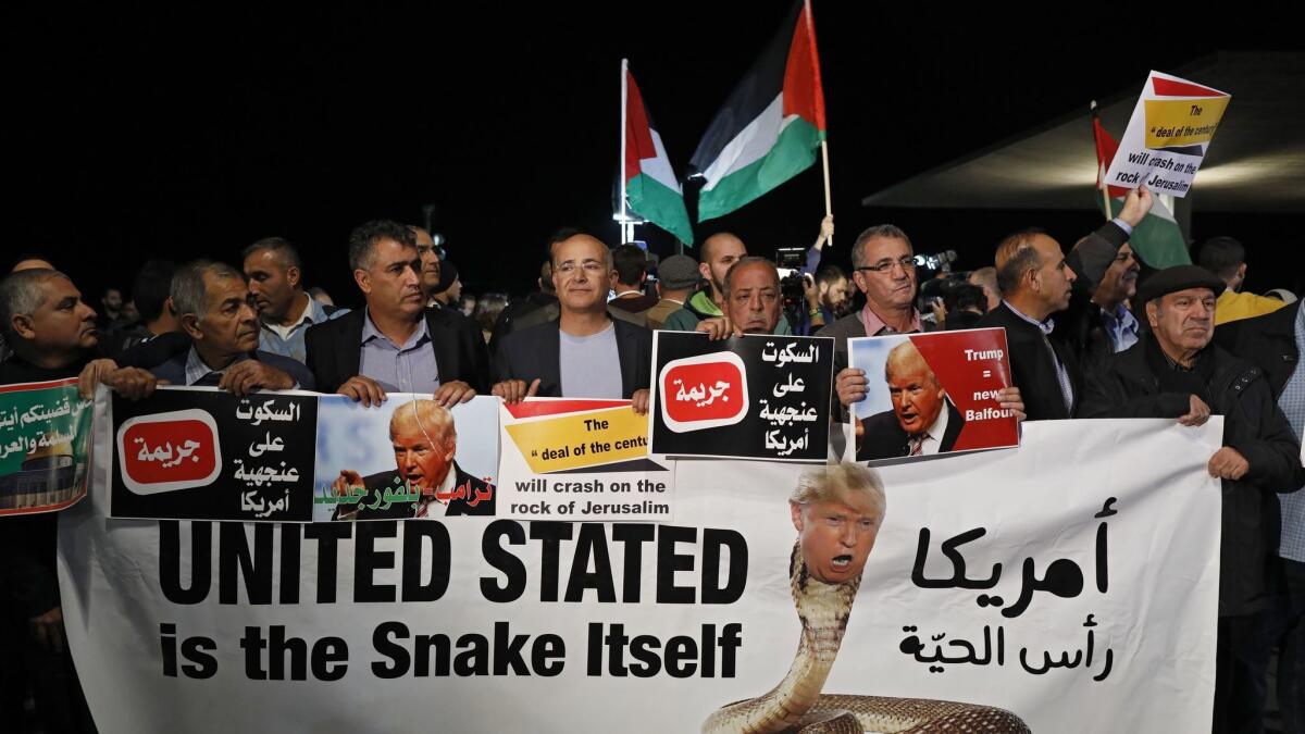 Israeli Arabs protest against President Trump's decision to recognize Jerusalem as the capital of Israel, in Tel Aviv on December 12.