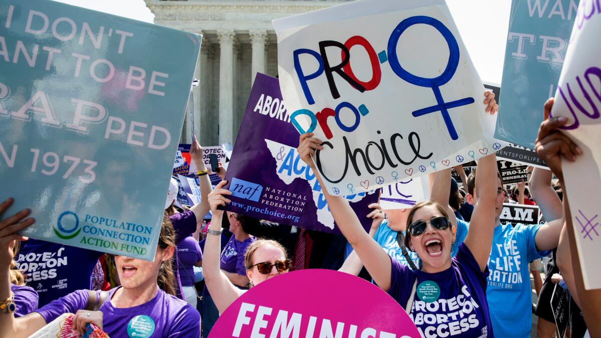 Pro-choice supporters celebrate outside the Supreme Court