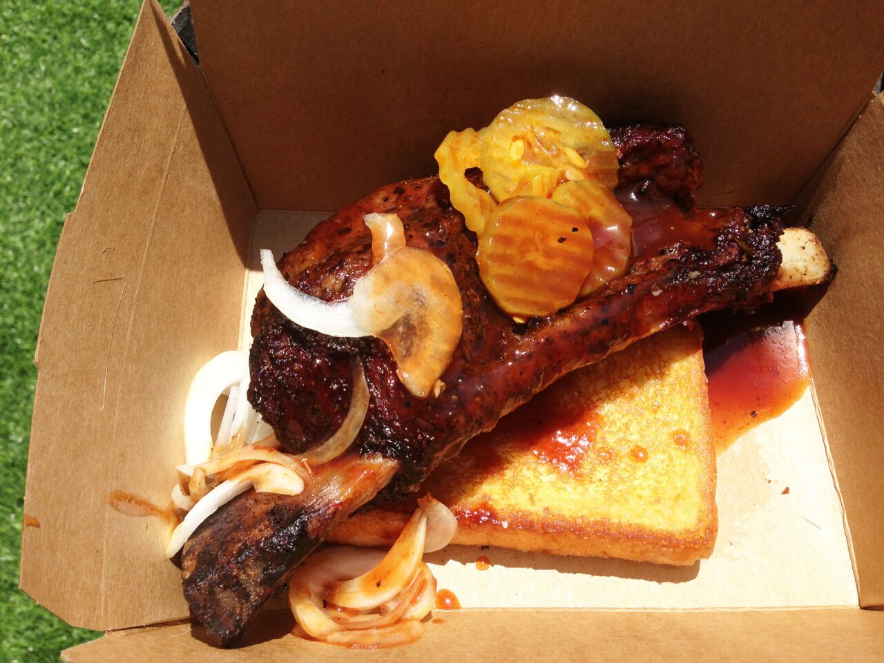 The beef rib with Texas toast, sweet onion and spicy pickles.