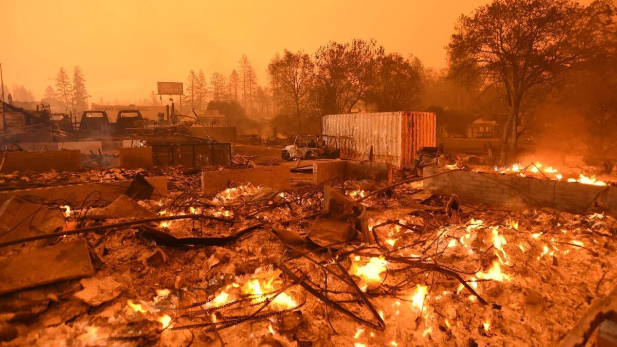 Businesses continue to burn in Paradise, which one woman raised there called "like Mayberry. It was this beautiful old mining town."