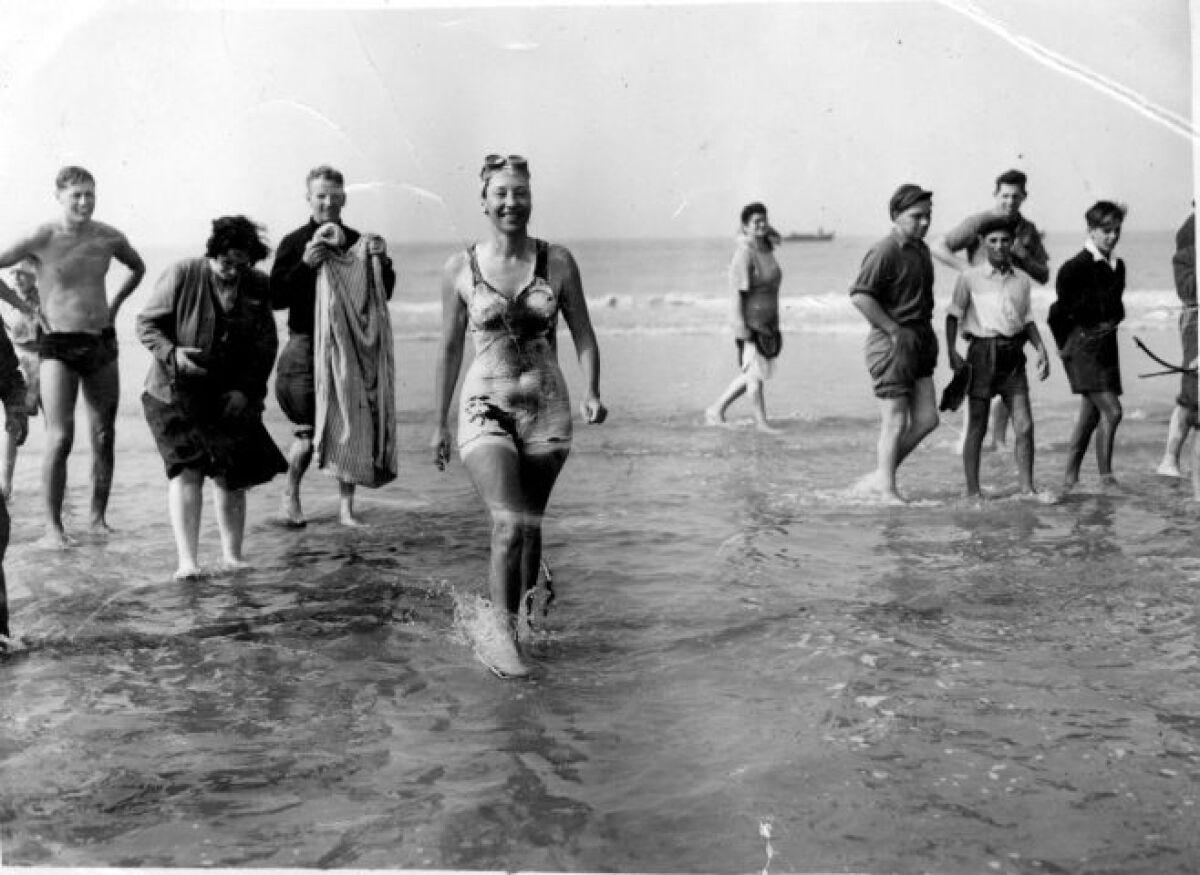 Long-distance swimmer Florence Chadwick wades ashore at Dover, England, after setting the women's speed record for crossing the English Channel on Oct. 12, 1950. The late San Diego native is the inspiration for The Florence, a new restaurant/bar that opened March 25 in Sabre Springs.