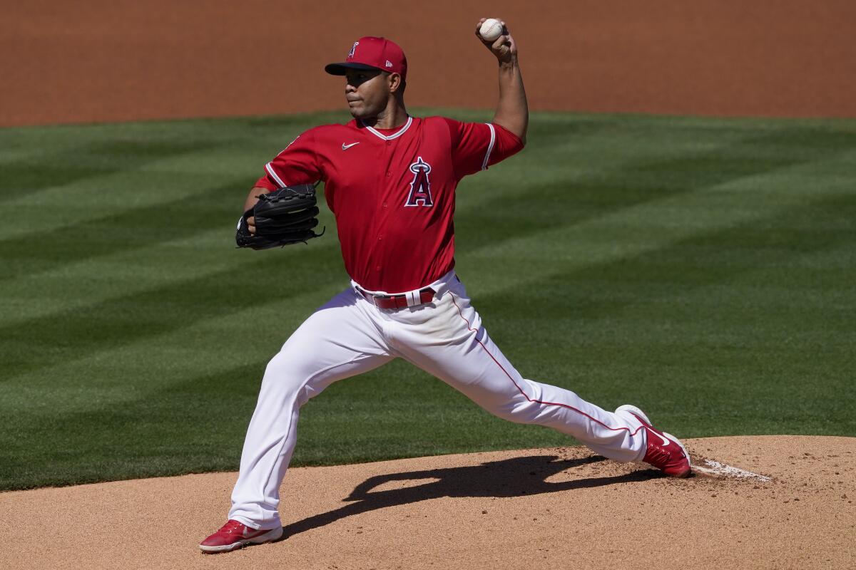 Angels starting pitcher José Quintana throws from the mound.