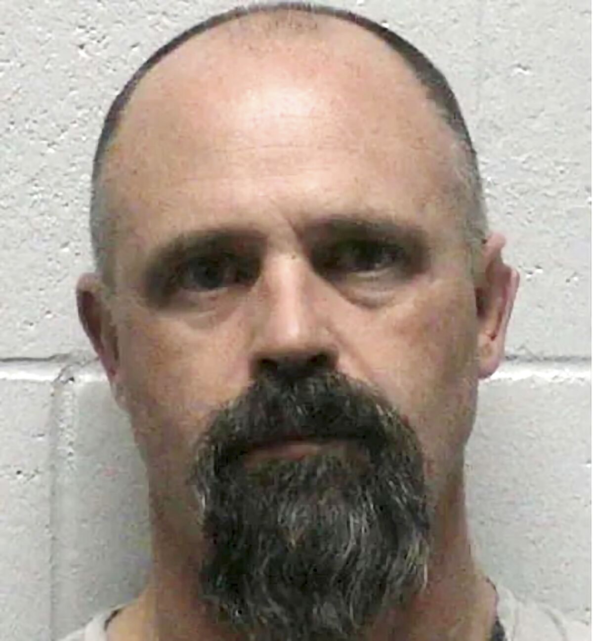 FILE -This photo provided by Lyon County Detention Center shows Troy Driver, 41, of Fallon, Nev., following his arrest Friday, March 25, 2022. Driver who was jailed a week ago on a kidnapping charge is now accused of killing the 18-year-old woman whose body was found this week in a remote grave in northern Nevada's high desert, sheriff's detectives said Friday, April 1, 2022. (Lyon County Sheriff's Office via AP, File)