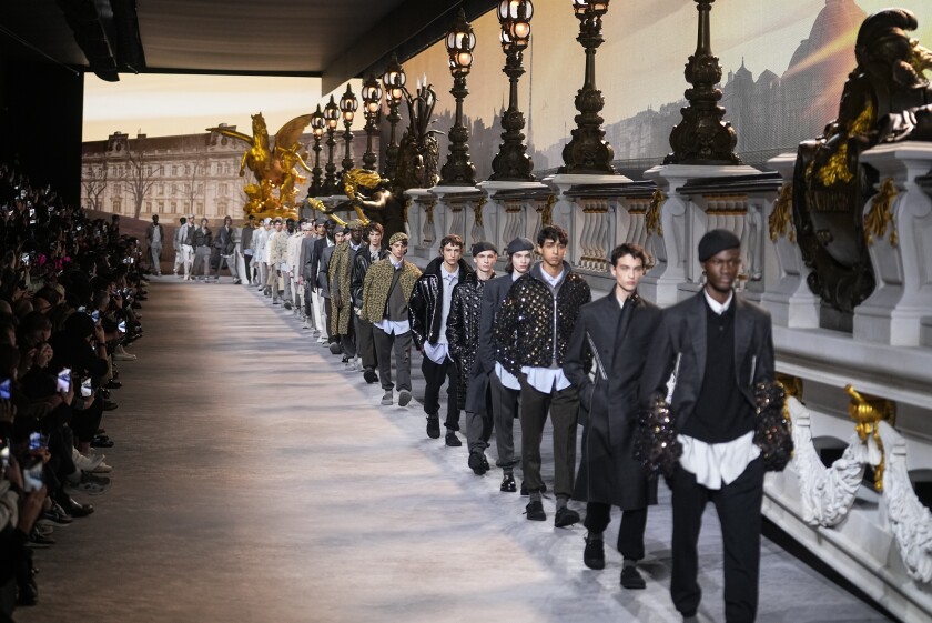 Models wear creations for the Dior fall-winter 22/23 men's collection, in Paris, Friday, Jan. 21, 2022. (AP Photo/Michel Euler)