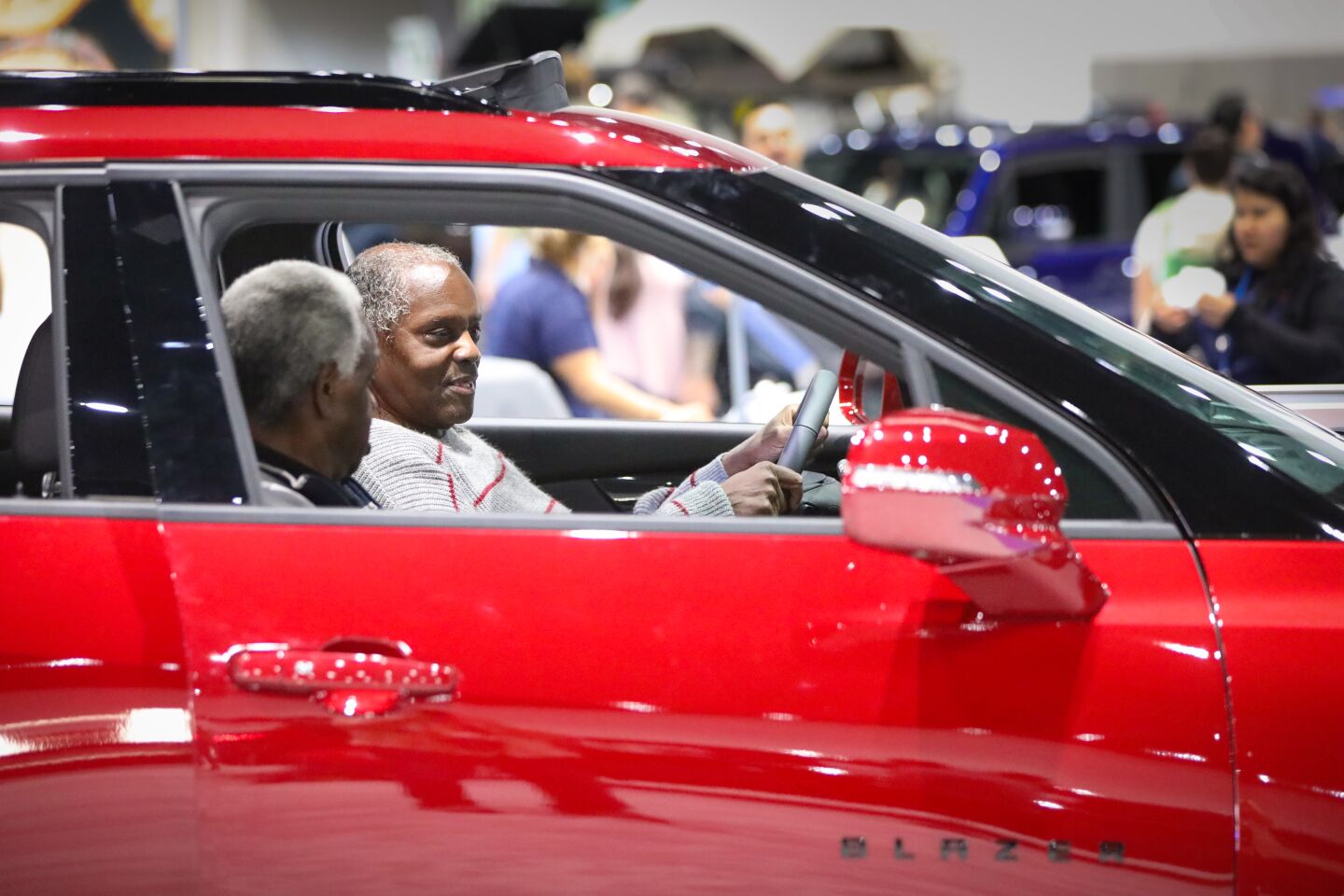 Richard Willston, foreground and Elmo Dill, background, both from Kensington, sit in a 2020 Chevrolet Blazer RS during the 2020 San Diego International Auto Show at the San Diego Convention Center, January 4, 2020.