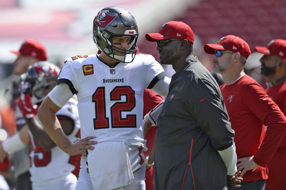 Tampa Bay Buccaneers quarterback Tom Brady (12) talks to defensive coordinator Todd Bowles.