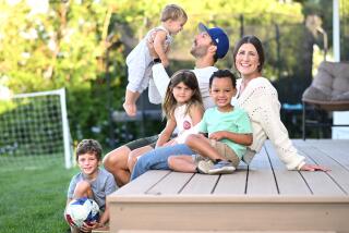 Palos Verdes, California September 13, 2023-LAFC defender Ryan Hollingshead and his wife Taylor play soccer with their children in the back yard of there home in Palos Verdes. (Wally Skalij/Los Angeles Times)