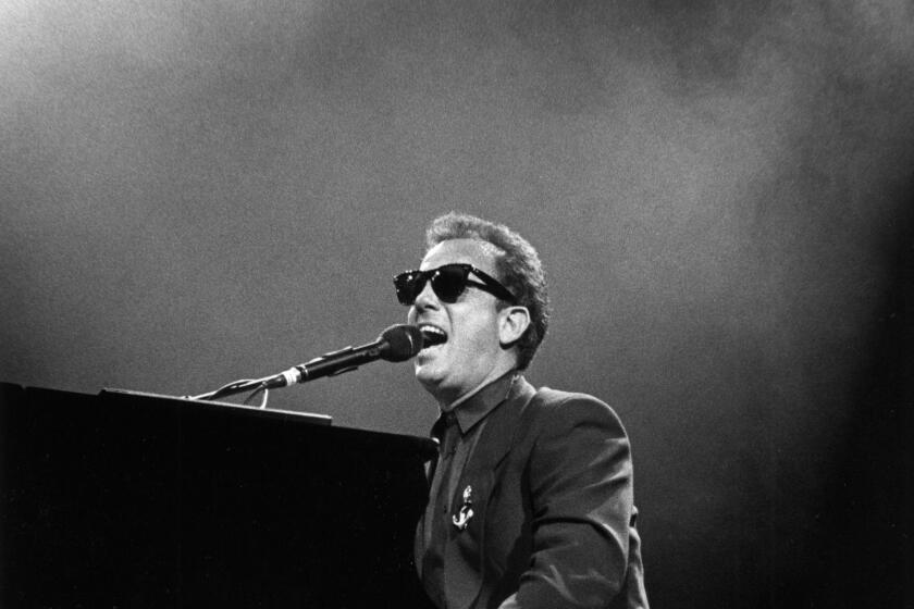 Billy Joel performing on stage in New York, 1989, piano, sunglasses (Photo by Nancie Hemminger/Ebet Roberts Photography/Redferns)