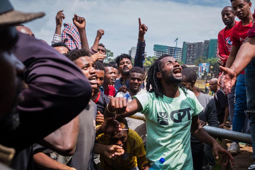 People react at Meskel Square in Addis Ababa, Ehiopia, to protest on September 17, 2018 against the killing of 23 people and displacment of residents in Burayu town over the weekend. - Ethnic violence in Ethiopia left 23 people dead at the weekend, state media reported on September 17, 2018, as protests against the killings gripped the capital Addis Ababa where an angry crowd gathered in the city centre. (Photo by Maheder HAILESELASSIE TADESE / AFP) (Photo credit should read MAHEDER HAILESELASSIE TADESE/AFP/Getty Images)