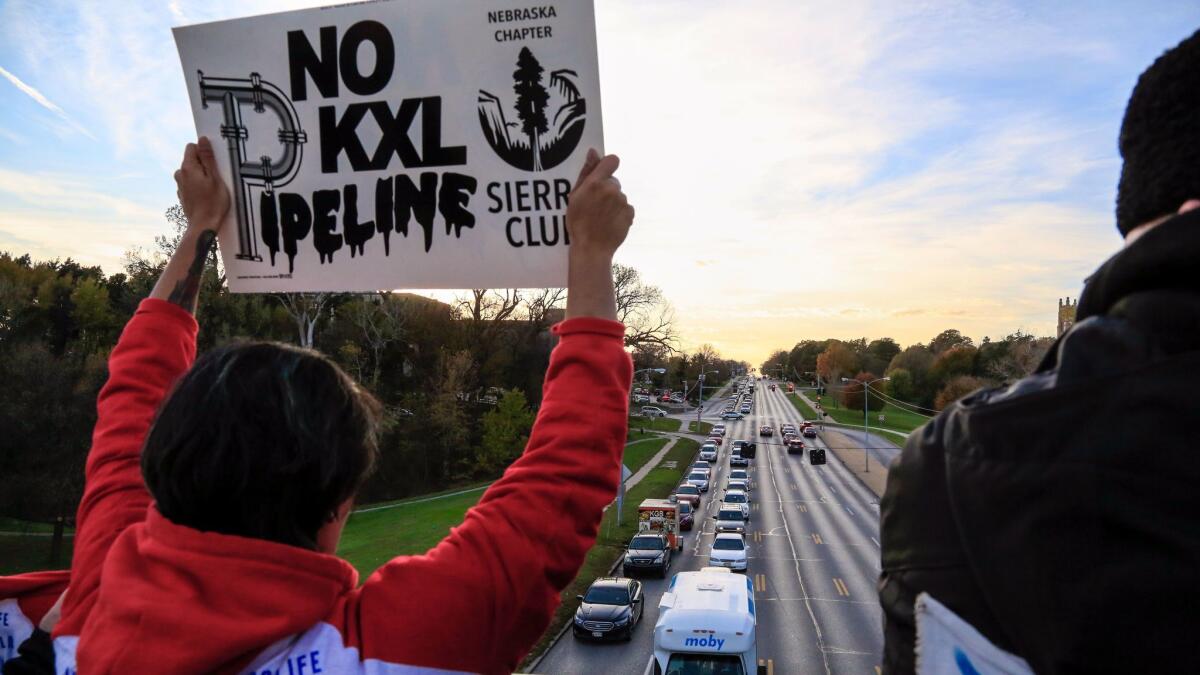 Opponents of the proposed Keystone XL pipeline demonstrate in Omaha, Neb., on Nov. 1. In South Dakota, 210,000 gallons of oil leaked from the Keystone pipeline, part of a 2,687-mile system that also is to include the proposed Keystone XL pipeline.