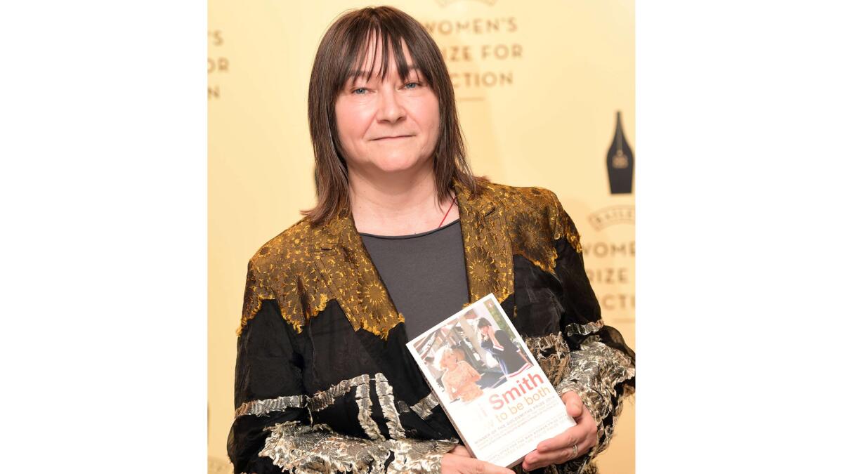 Ali Smith holds her novel "How to Be Both" during a photocall for the presentation of the Baileys Women's Prize for Fiction in London on June 3.