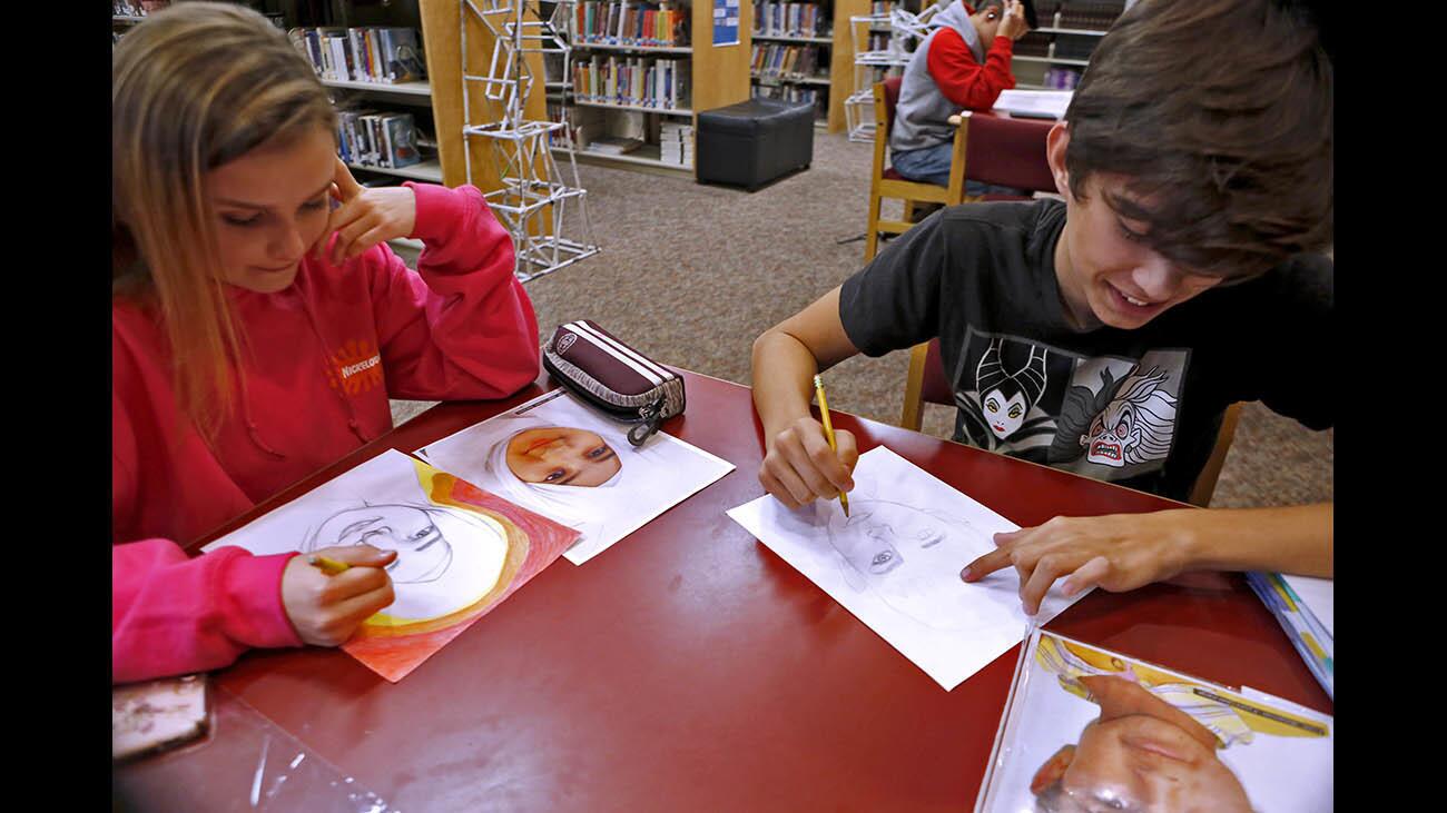 Photo Gallery: Burroughs High School students work on Portraits of Kindness project