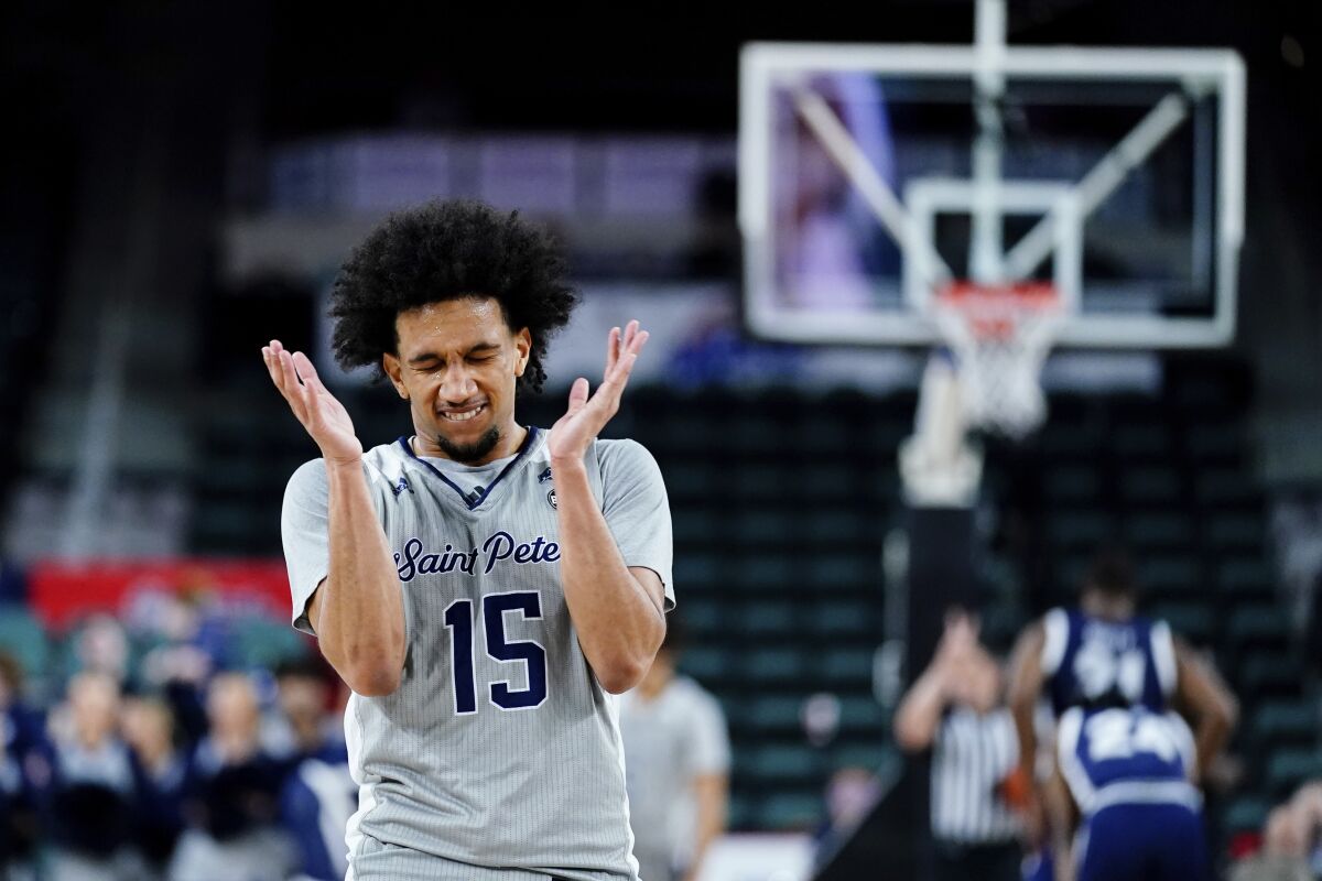 St. Peter's Matthew Lee reacts during the second half of an NCAA college basketball game against Monmouth during the championship of the Metro Atlantic Athletic Conference tournament, Saturday, March 12, 2022, in Atlantic City, N.J. St. Peter's won 60-54. (AP Photo/Matt Rourke)