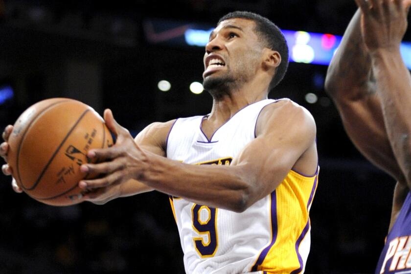 Lakers guard Ronnie Price puts up a shot in a game against Phoenix this season.